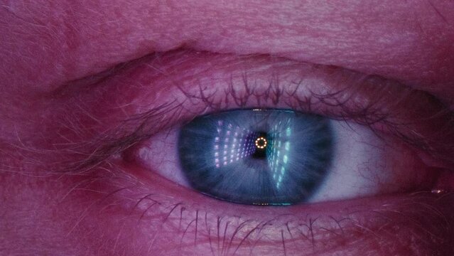 A scary and terrible human eye. The blue pupil is surrounded by veins and vessels. The eyeball of a nervous and frightened person. Wakes up from fainting or coma.