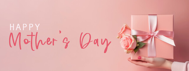 Fototapeta na wymiar Happy Mother's Day concept celebration holiday greeting card banner background - Girl holding a present gift box with pink bunch bouquet of roses flowers in her hands