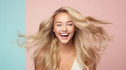 Fotobehang Explore hyper-realism in capturing the cheerful expression of a young woman with beautifully styled long blonde hair, set against a pastel flat background © anupdebnath