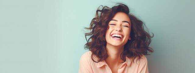 Retain the theme of a smiling young woman on a pastel flat background with copy space, and apply a cinematic filter for a vintage film photography look