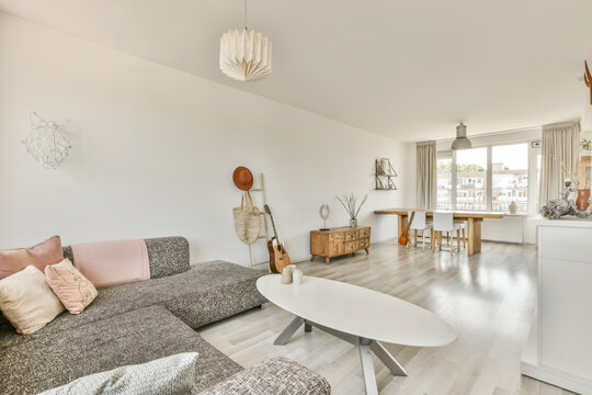 Modern living room with natural light and cozy decor