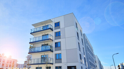 Modern apartment building in sunny day. Exterior, residential house facade. Residential area with modern, new and stylish living block of flats. 