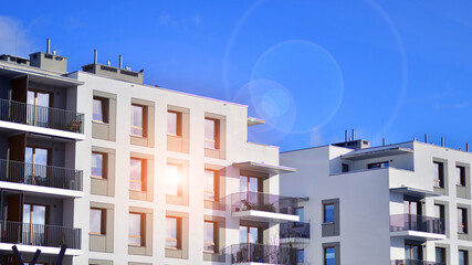 Modern apartment building in sunny day. Exterior, residential house facade. Residential area with modern, new and stylish living block of flats. 