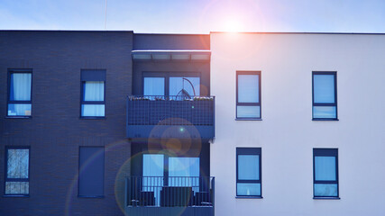 Modern apartment building in sunny day. Exterior, residential house facade. Residential area with modern, new and stylish living block of flats. 