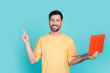 Photo of young brunet man wearing yellow t shirt recommend it courses for beginners holding...