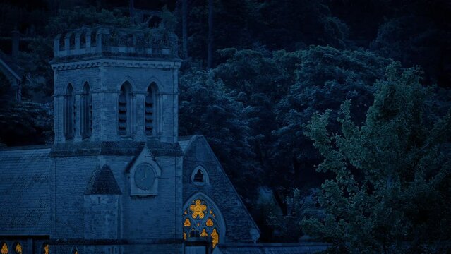 Church Service In The Evening Buidling With Lit Up Windows
