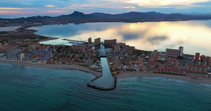 Aerial view of La Manga del Mar Menor in Murcia Spain Mediterranean coast, aerial footage at sunset