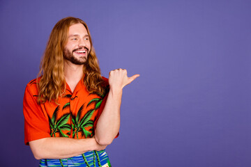 Photo of cheerful person with long hairstyle dressed print shirt look directing at promo empty...