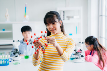 Portrait of Primary class children engaged in hands-on scientific experiments. Students discovering the wonders of science through interactive and engaging experiments.