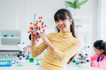 Portrait of Primary class children engaged in hands-on scientific experiments. Students discovering the wonders of science through interactive and engaging experiments.