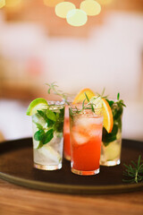 Two cocktail glasses on tray in the bar