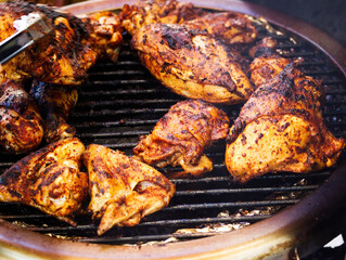 Several Pieces Of Chicken Cooking On Barbecue Grill