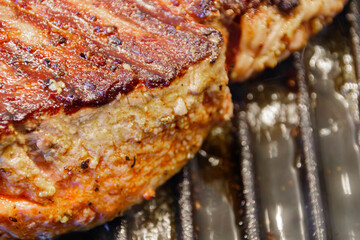 Large piece of fresh beef meat prepared on a grill pan. Toned.