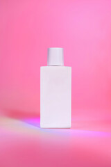 Perfume bottle photographed with minimal and creative background.