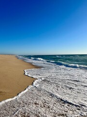 Sand beach, sea coastline, pure blue sky, natural seascape background, no people