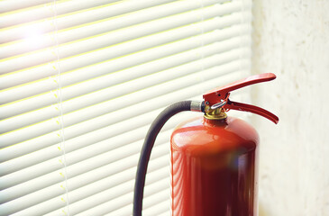 Fototapeta premium Fire extinguisher has hand engineer inspection checking pressure gauges to prepare fire equipment for protection and prevent emergency and safety rescue and alarm system training concept.