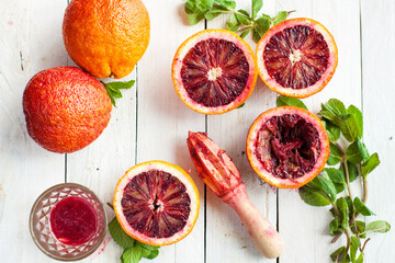 Blood Oranges and Fresh Mint on Wooden Surface