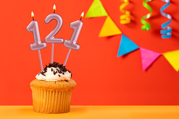 Number 121 Candle - Birthday cupcake on orange background with bunting