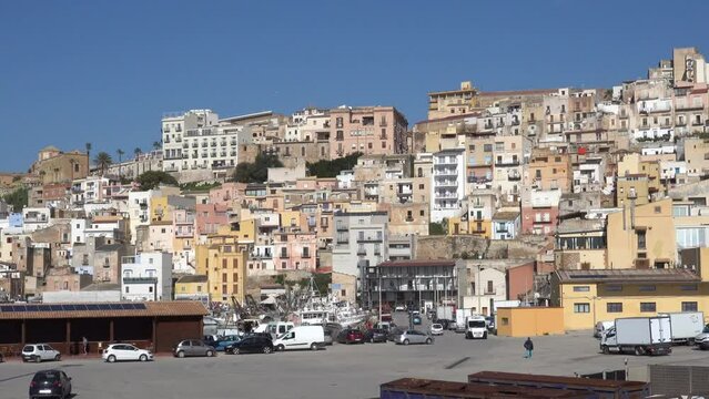 Sciacca, Sicily, Italy The old fishing port with fishing boats and skyline with old houses. 