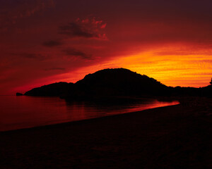 Fototapeta premium Fire sunset in Cilento, Foce del Mingardo