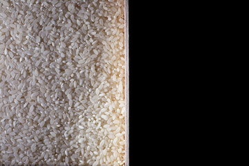 A set of grain cereals. Rice, buckwheat and millet groats in a wooden tray. A grocery set of cereals. Import of grain.