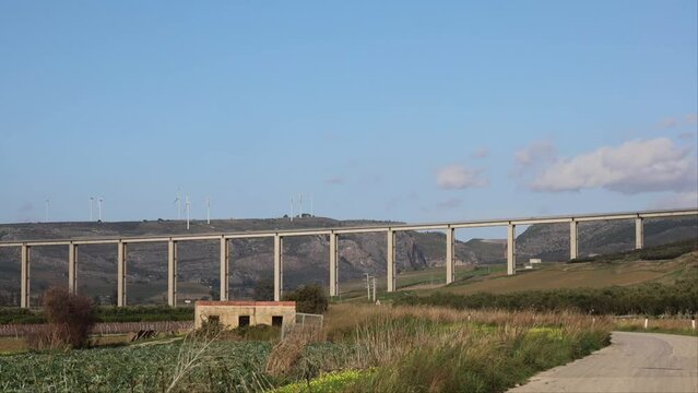 Sciacca, Sicily, Italy The SS115 bridge with wind turbines in the distance.