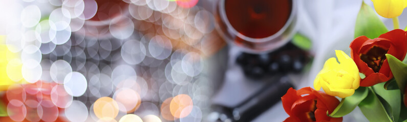 Glass with grape red semi-dry wine. Valentine's day concept background. Gift for the holiday. Sweet...