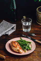 Fototapeta na wymiar Baked Chicken Breast and Fried Green Beans