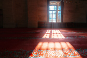 Islamic background photo. Sunlight coming through from a window in a mosque - obrazy, fototapety, plakaty