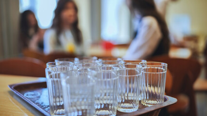 Glass tumblers in the school cafeteria.