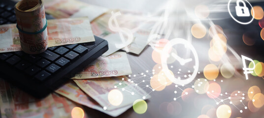 Russian rubles are on the table next to the computer, Notepad in the office or Bank. Savings and...