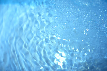 Fototapeta na wymiar Blue water texture. Bubbles and bubbling water.
