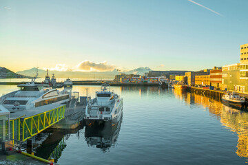 View of a marina and harbor in Tromso, North Norway. Tromso is considered the northernmost city in...