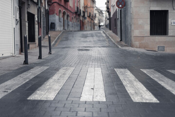 Street after the rain. Zebra crossing