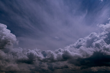 Fototapeta na wymiar Cumulus clouds in the blue sky close-up, cold blue sky, among the clouds