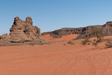 Fototapeta na wymiar Bouhadian rock formations in Tadrart Rouge, Tassili N'Ajjer National Park. Sahara, Algeria, Africa.