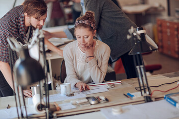 Two colleagues collaborating in a modern office environment