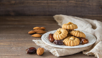 A rustic composition of gourmet almond cookies, dates, and almonds on a wooden backdrop, evoking a sense of tradition and comfort.