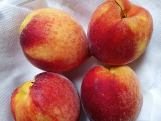 Fototapeta na wymiar Four ripe peaches