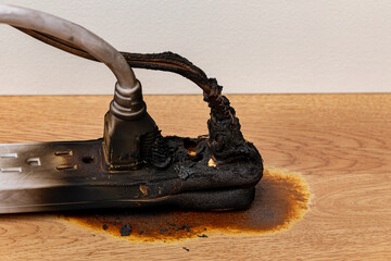 Electrical surge protector outlet and extension cord fire. Electricity safety, fire hazard and...