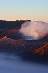 Scenic view of Mount Bromo in the morning with red shiny sunlight during sunrise. © Wirestock