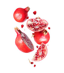 Group of ripe whole and sliced pomegranates in the air on a transparent background