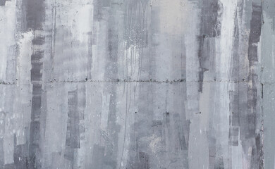 Concrete wall background with abstract strokes and splashes of paint. Abstract art wall texture.