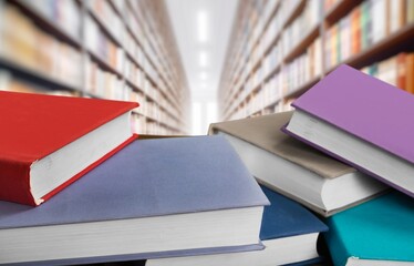 Books, notebooks lie in library background