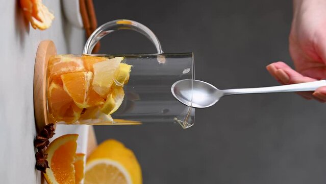 Immune boosting drink. Ginger, orange fruit and turmeric shot drink, healthy beverage. Vertical 