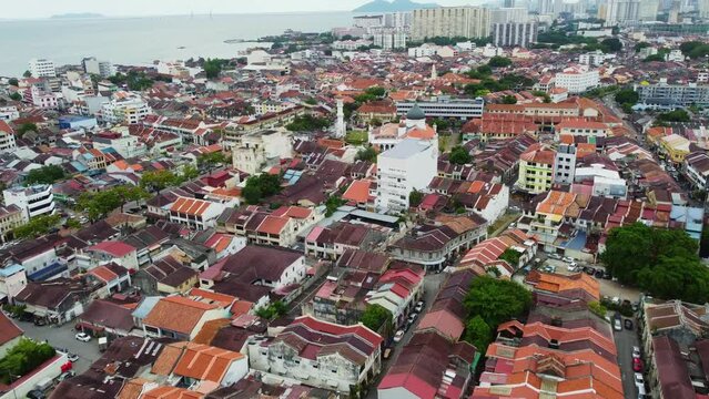 Penang, Malaysia: Aerial drone footage of the famous Kapitan Keling mosque in the heart of Georgetown historic city center with its chinatown and little India in Penang in Malaysia