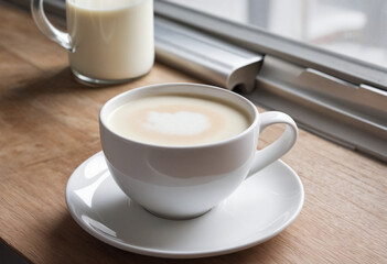 Fototapeta premium Fresh white milk in a close-up cup, enticingly poised for enjoyment on the table.