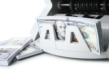 Modern cash counting machine with dollar banknotes on white background, closeup