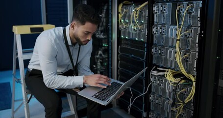 Technician, server room and computer with cables connection for system maintenance, hardware or software backup. Man or programmer typing on laptop for engineering, repair and coding in a data center