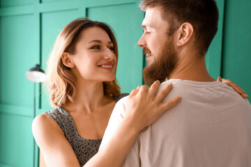 Naklejka premium Happy couple in love hugging at home, closeup